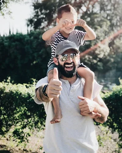 Dad laughing with son